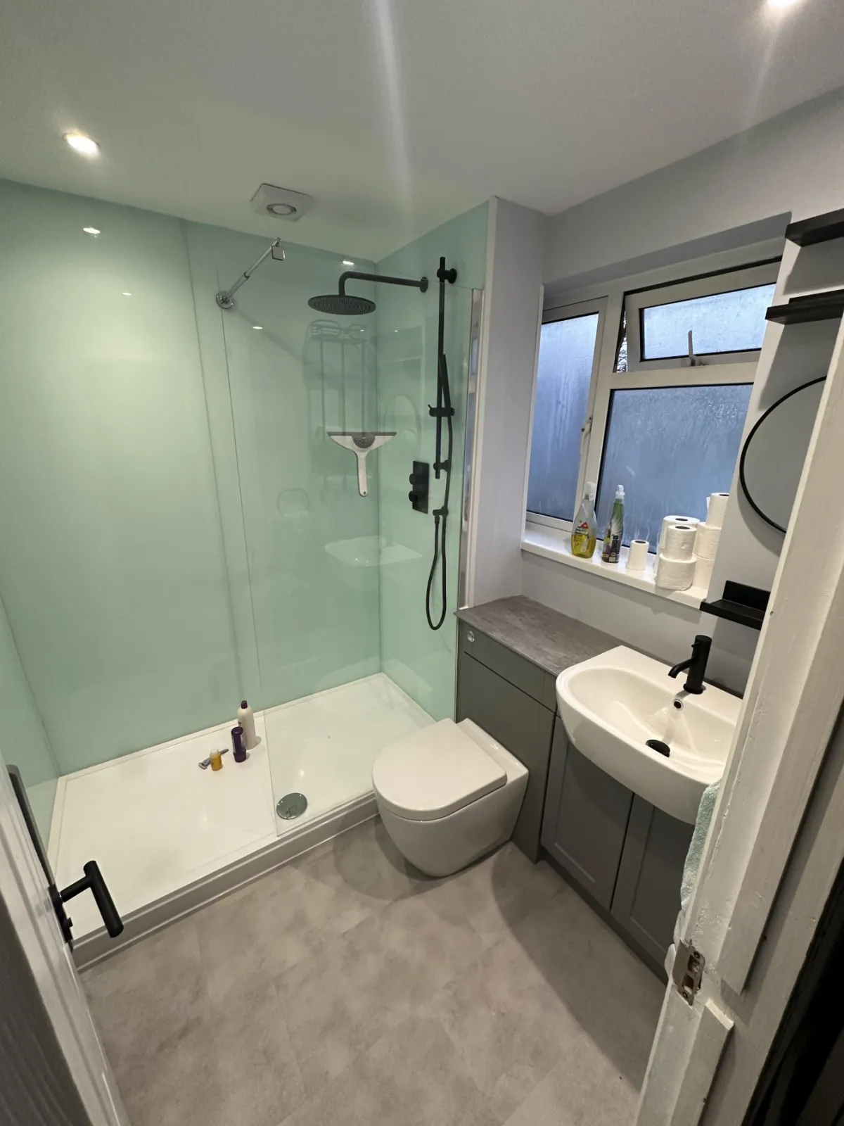 Shower room with glass splashbacks
