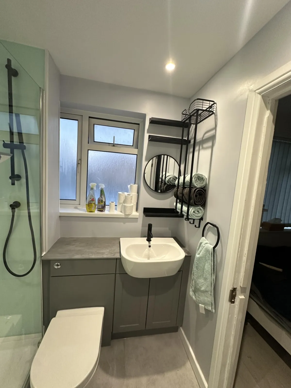 Shower room with glass splashbacks gallery