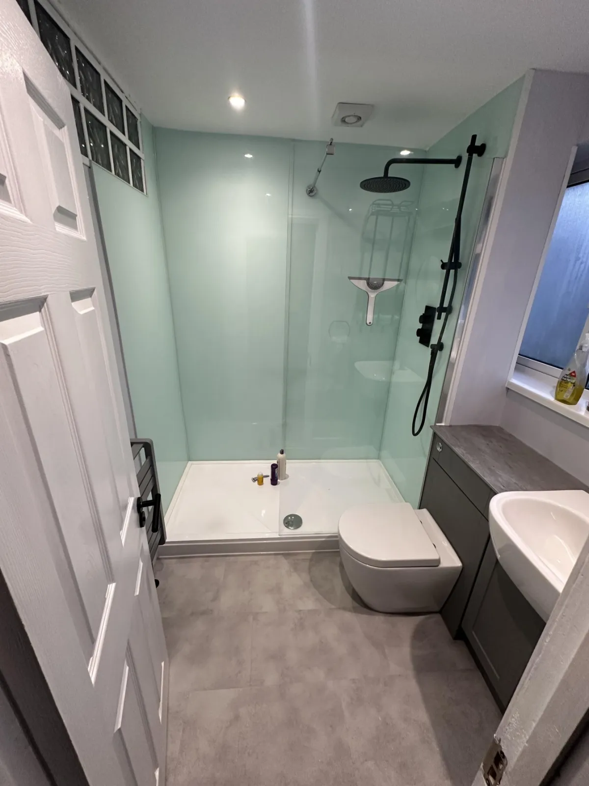 Shower room with glass splashbacks gallery